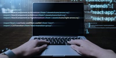 programming-background-with-person-working-with-codes-computer